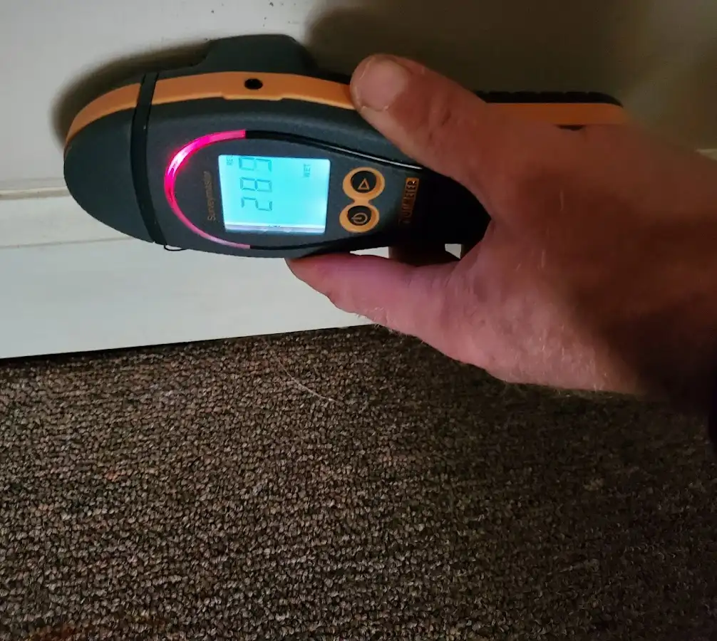 Moisture detection at baseboard during Burst Pipe Cleanup in Bondurant